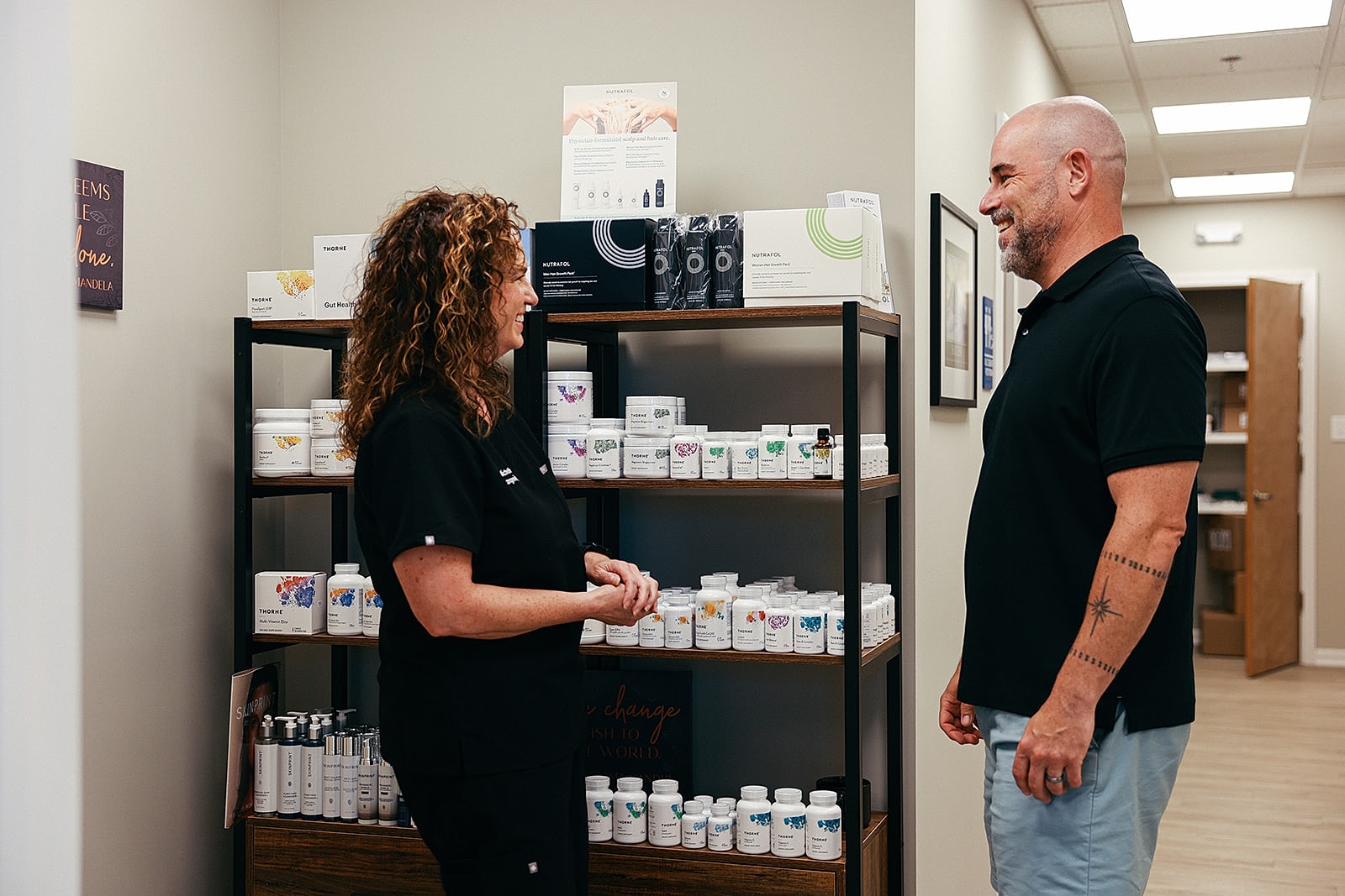 Consultation in wellness store featuring various products.
