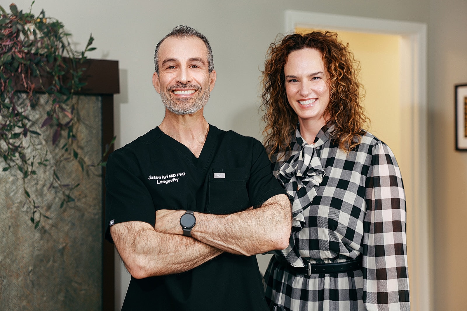 Healthcare professionals smiling together in an office.